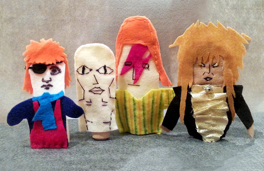 Four finger puppets created by students to represent various phases of David Bowie's career